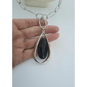 Lia Sophia necklace, silver tone with black pendant. 28 inches long with 2 1/2